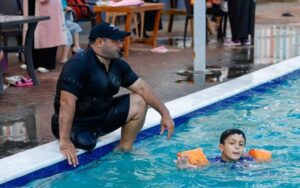 Gaza amputee is inspiration to young swimmers