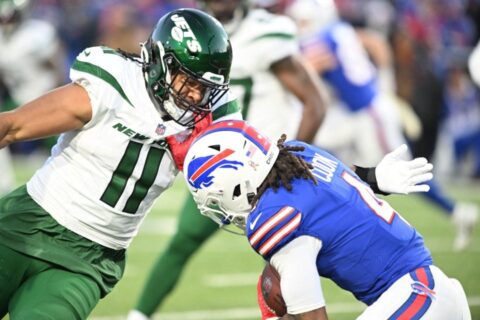 Nov 19, 2023; Orchard Park, New York, USA; New York Jets linebacker Jermaine Johnson (11) prepares for a tackle on Buffalo Bills running back James Cook (4) in the first quarter at Highmark Stadium. Mandatory Credit: Mark Konezny-USA TODAY Sports